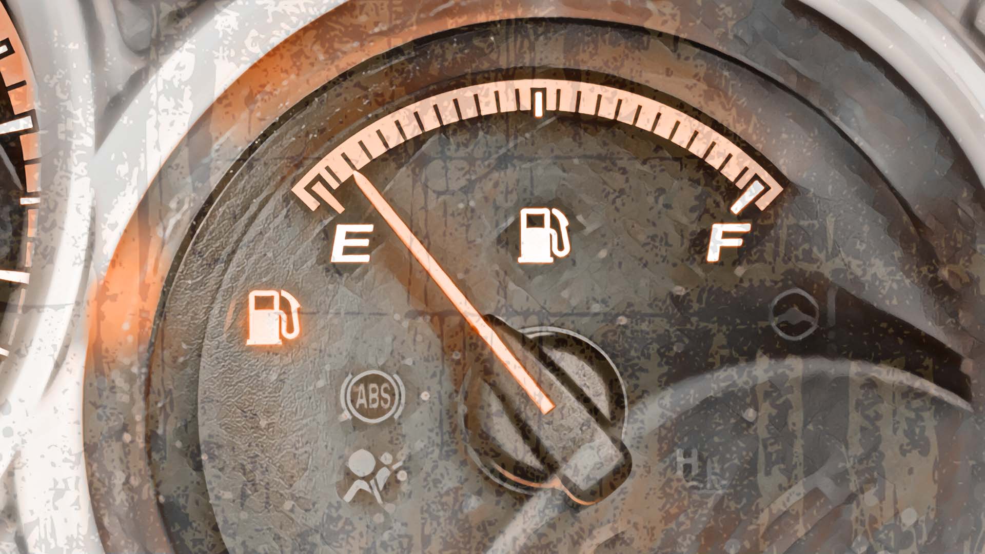 A fuel gauge is indicating a low level of fuel in a vehicle.