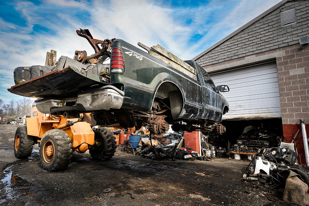 Truck on lift at a junk yard