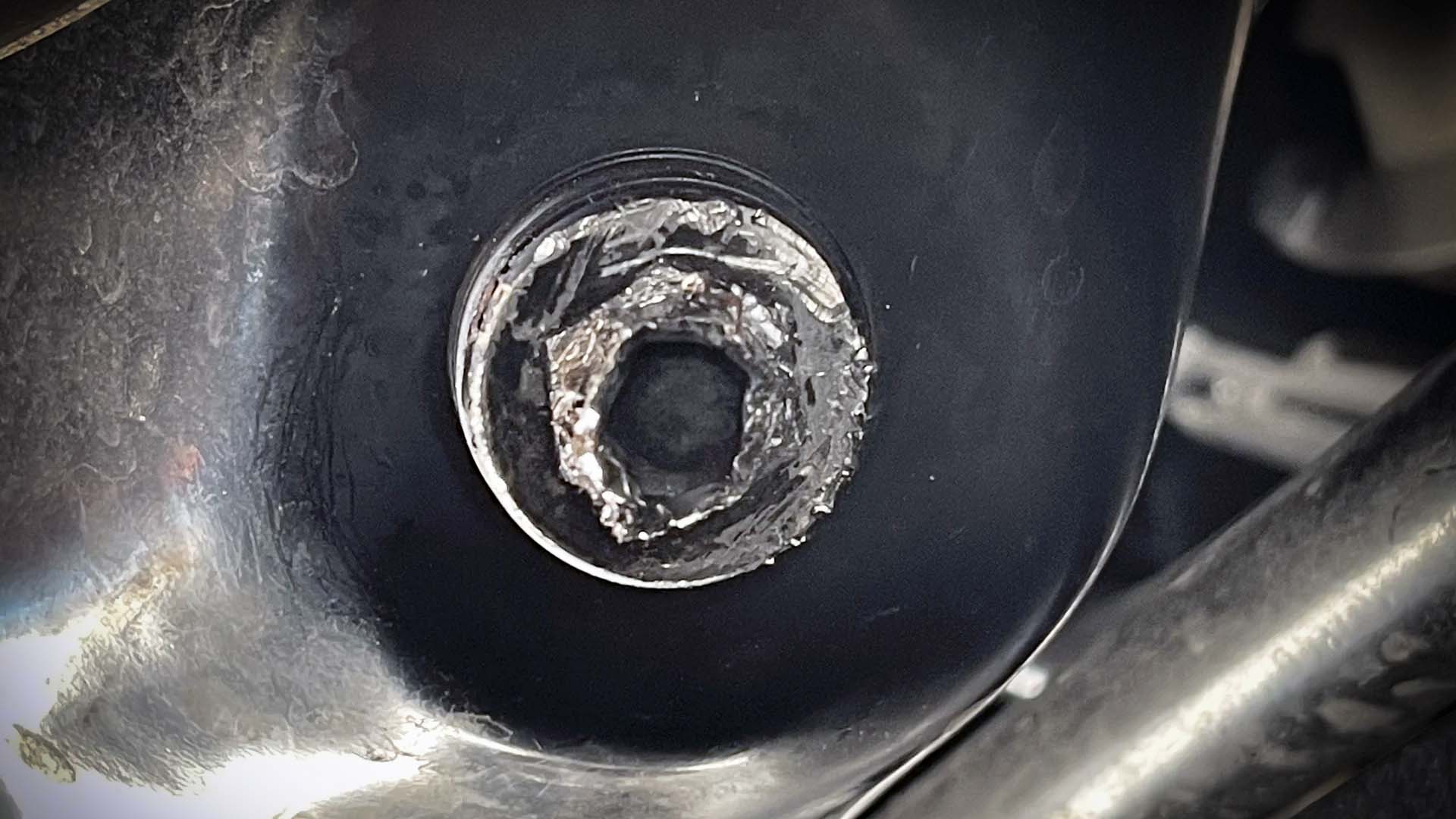 Stripped oil drain plug
